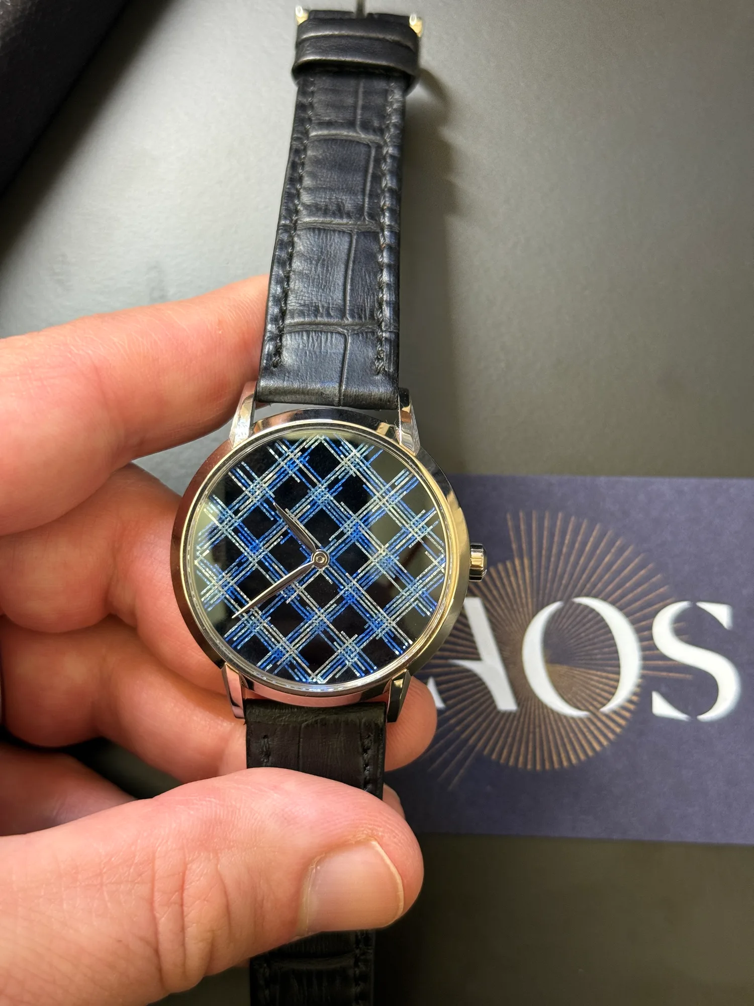 TAOS Tuxedo and its blue woven-effect enamel dial